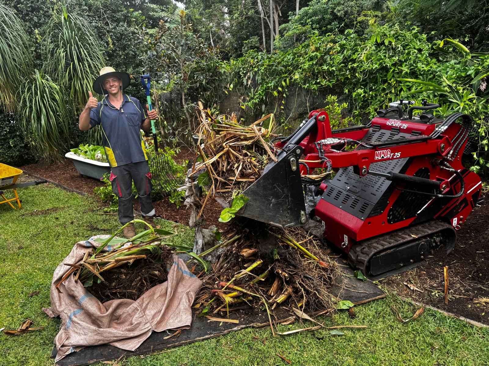 OMG Lawn Care team completing a Brisbane garden clean-up with professional equipment